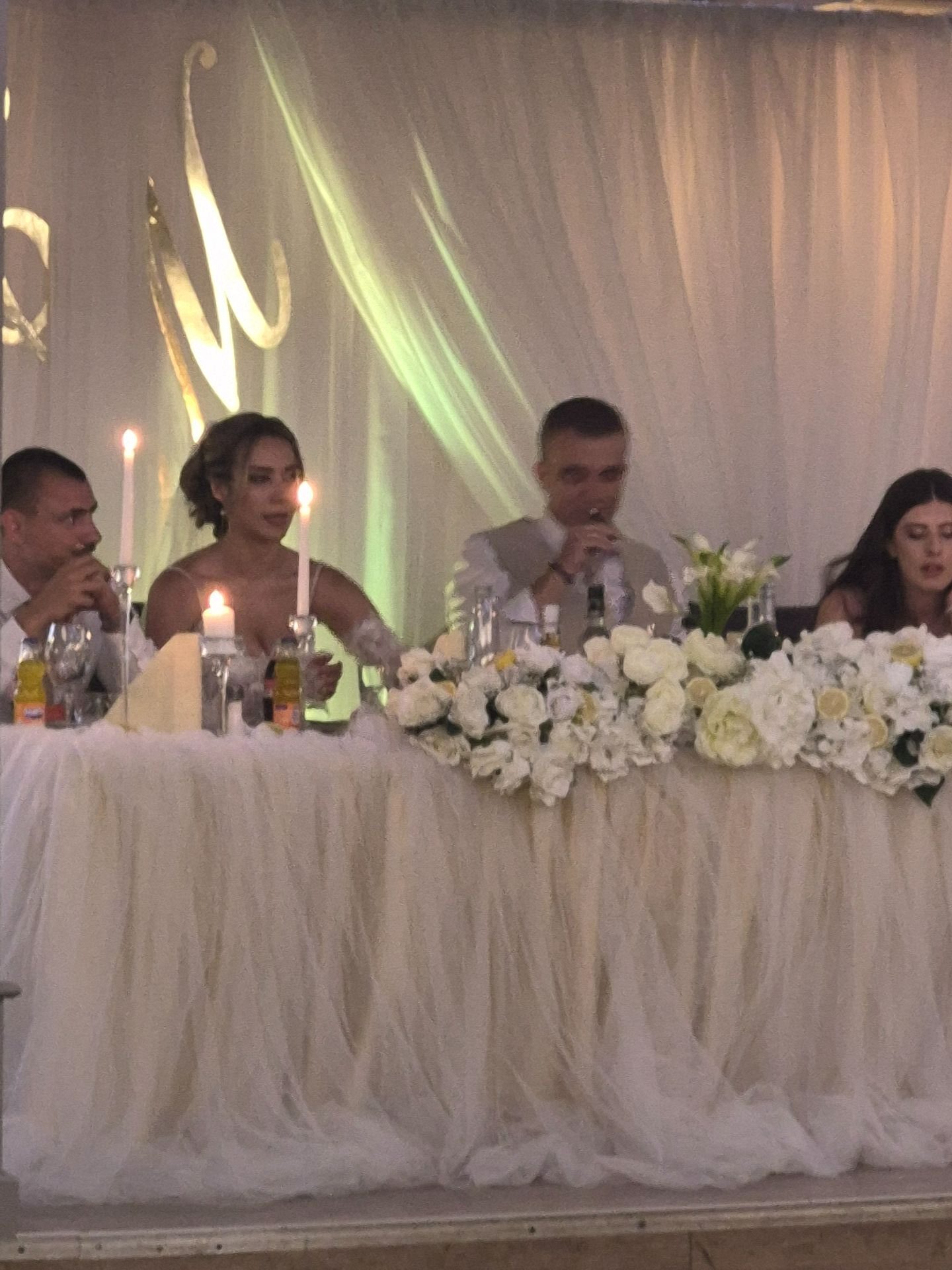 Makasa Etch Blueprint wedding table setup with floral arrangements and candles.